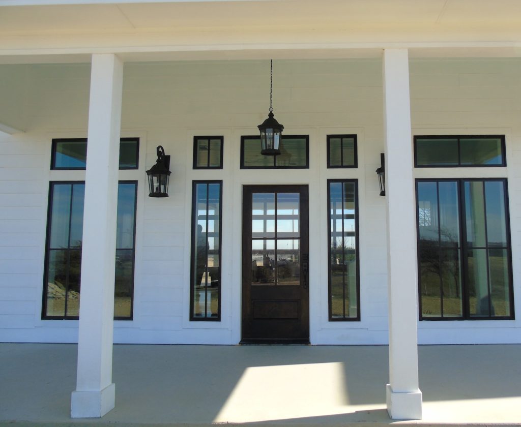 A modern yet classical design of the front entry of our newest and most popular home plans. 